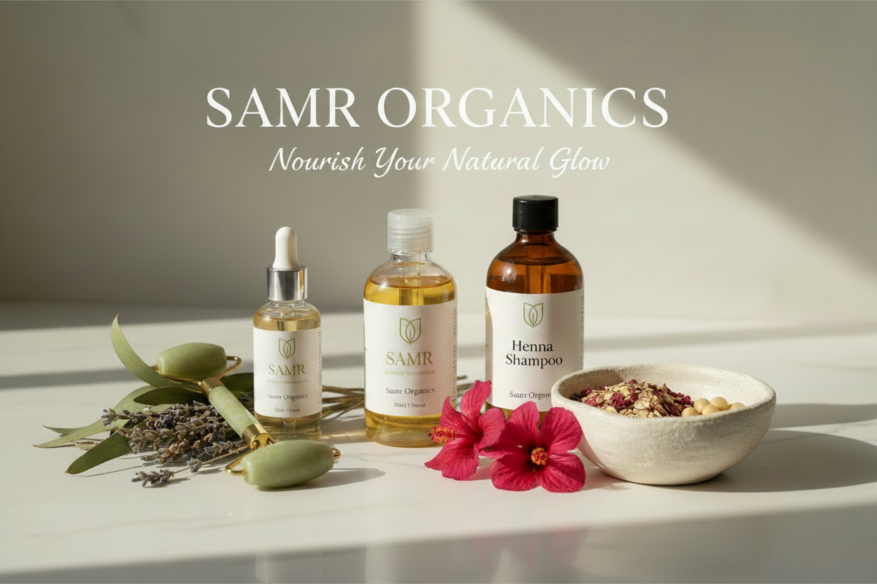 SAMR Organics hair care products on a light surface with flowers and herbs.